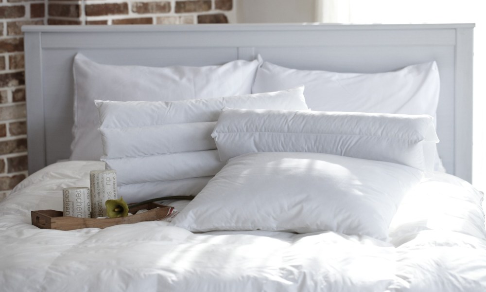 White pillows on a bed.