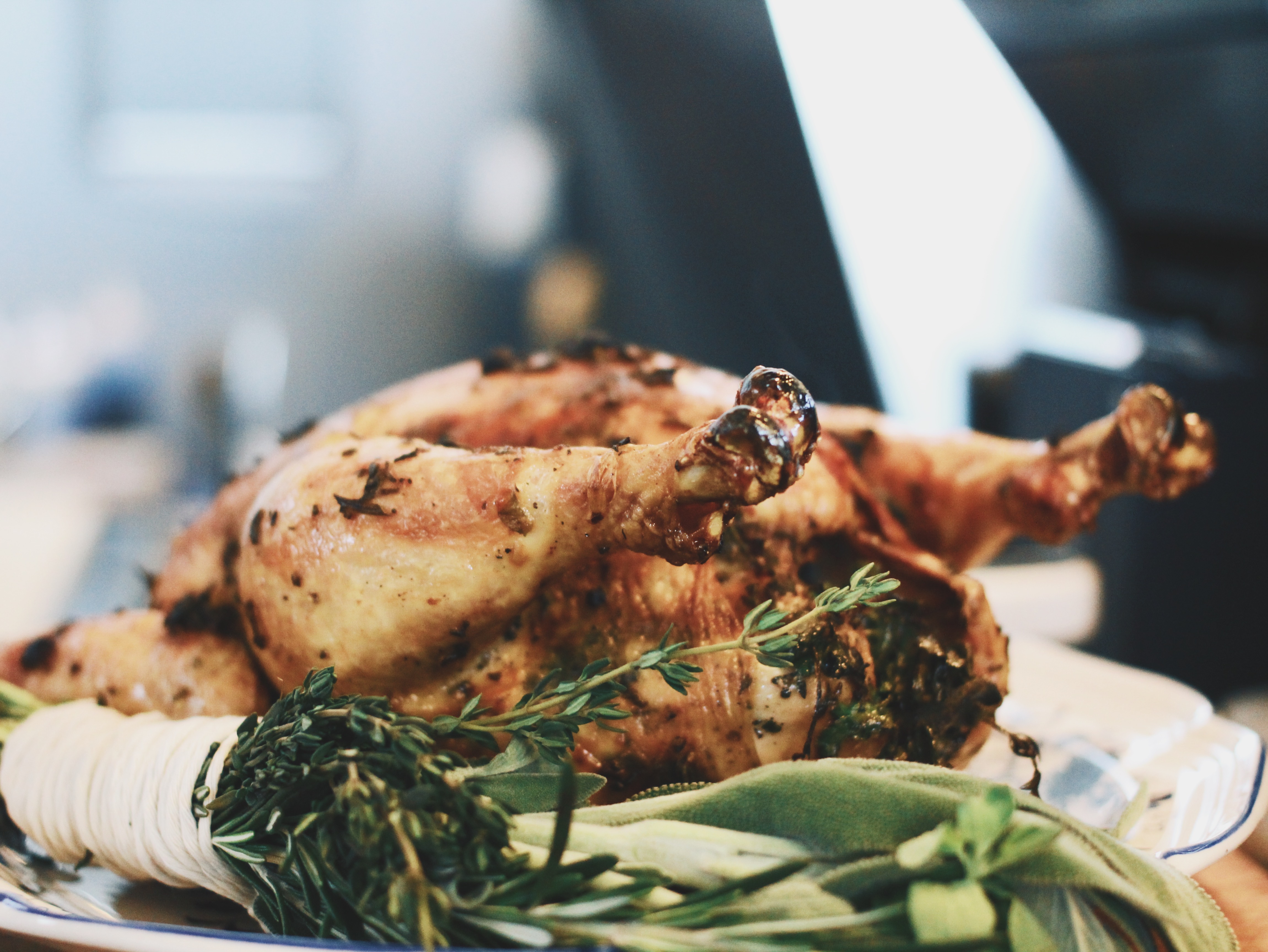 A whole roasted chicken served on a plate.