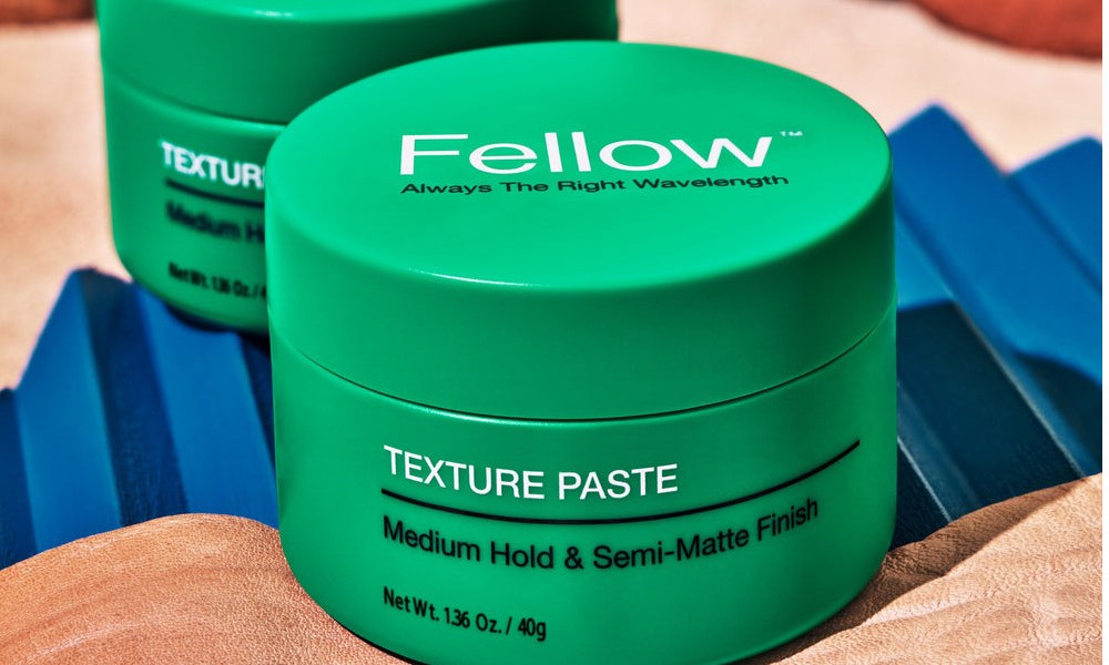 Two containers of Fellow Barber Texture Paste.