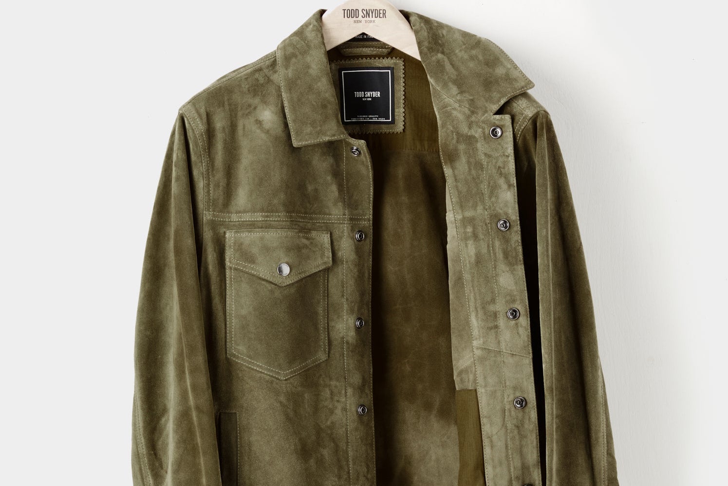 A hanging Todd Snyder Dylan Jacket in olive suede.