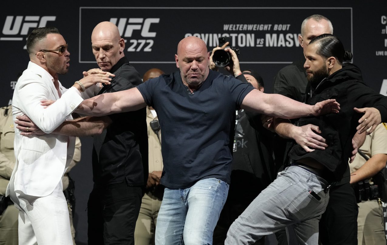 Dana White separates two fighters.