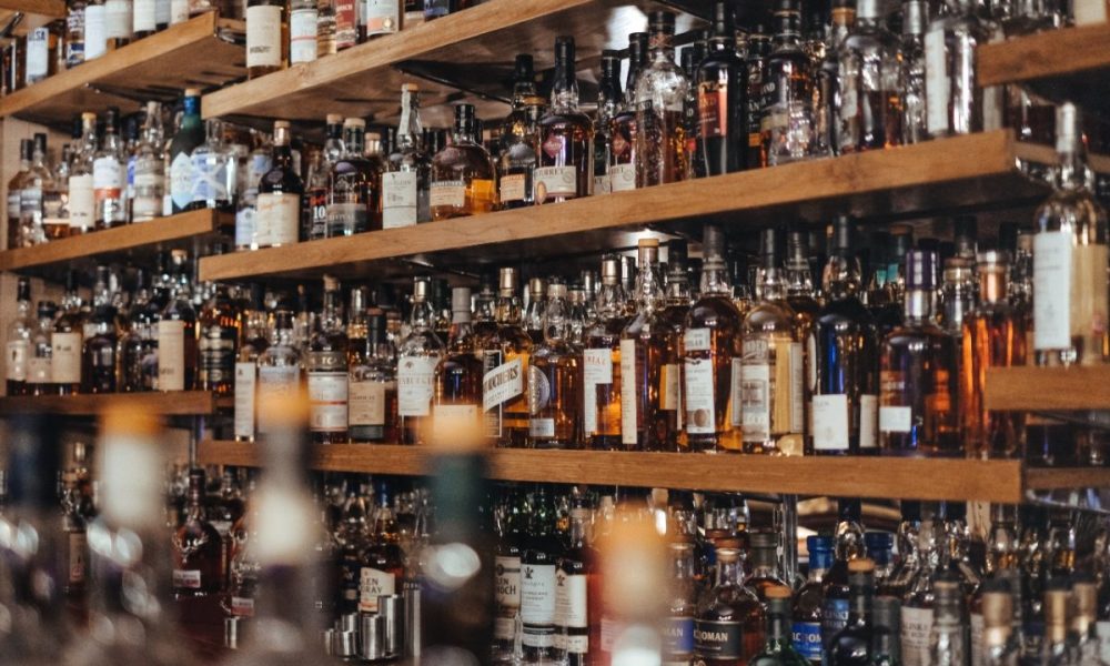 An assortment of liquor bottles on shelves