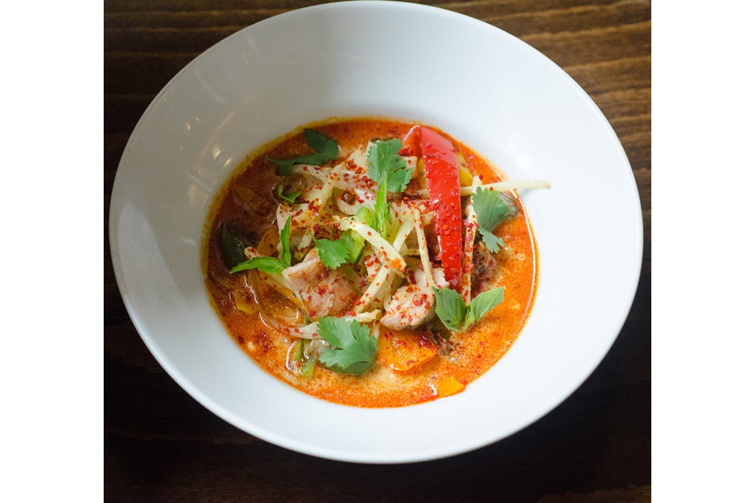 bowl of red curry with chicken.