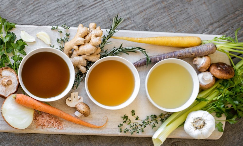 Bowls of bone broth on a tray