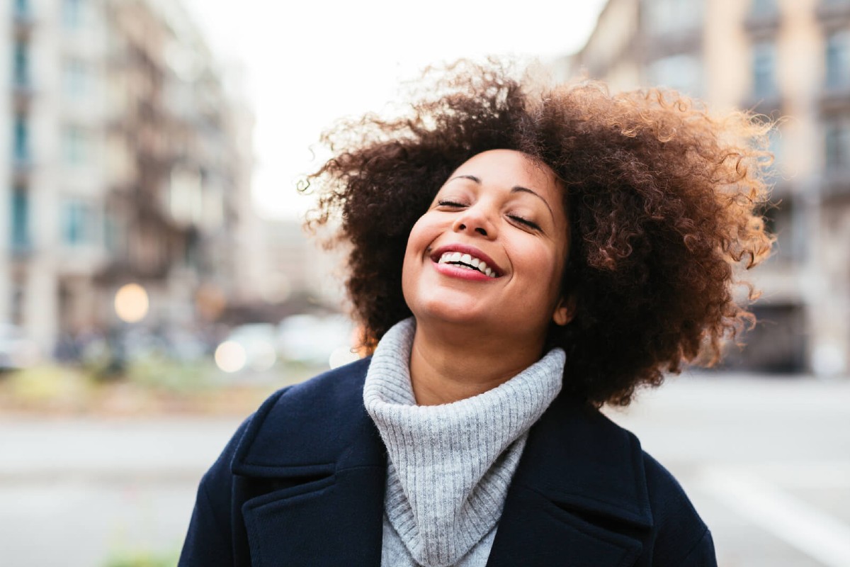 A model smiles at Shine app's benefits.