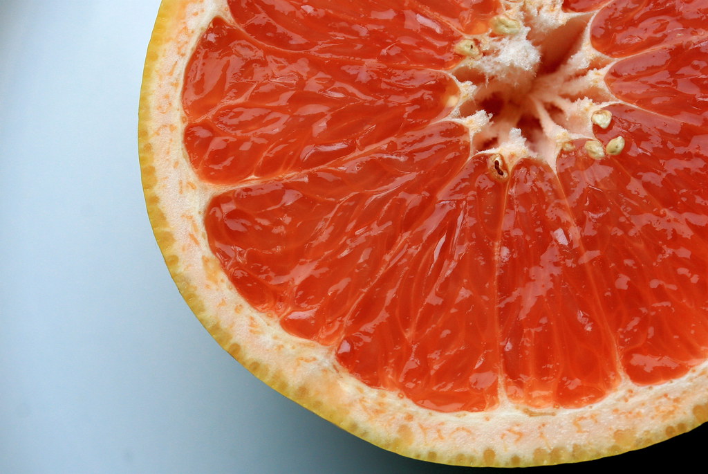 A sliced pink grapefruit