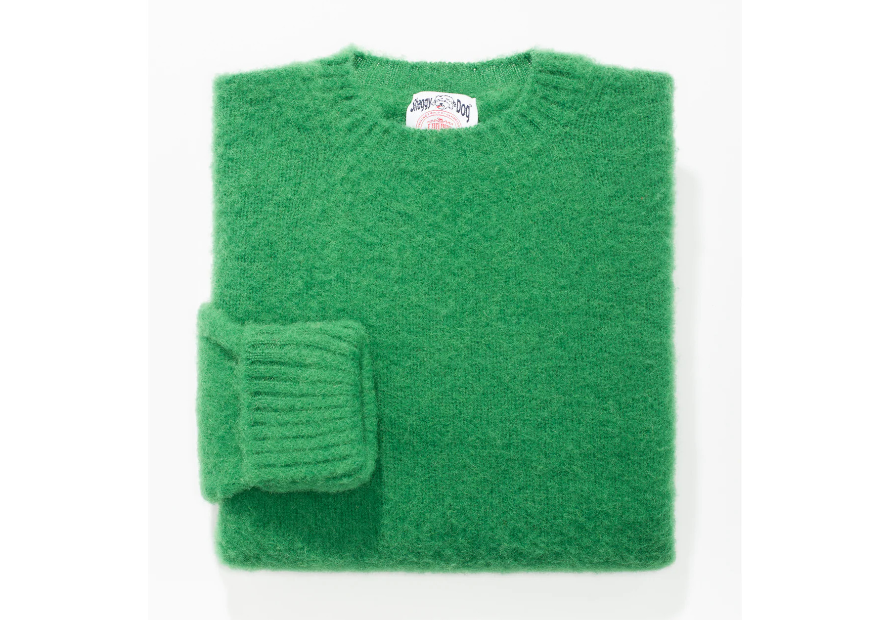 green crewneck wool sweater folded.