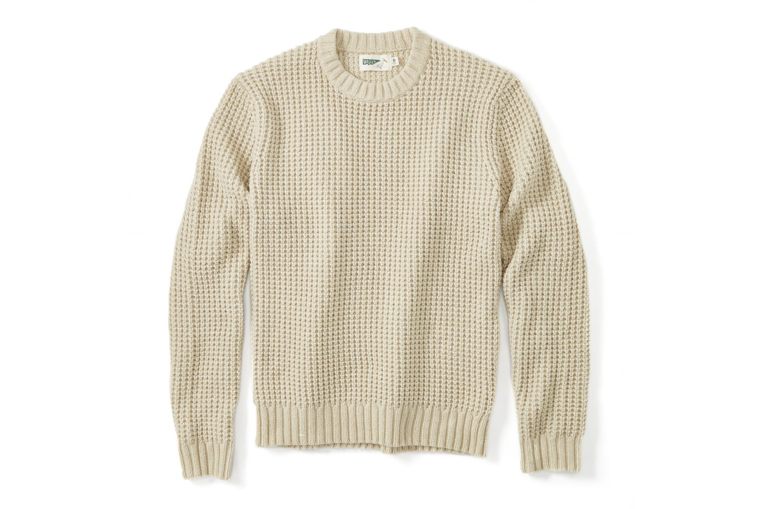 A cream cotton crewneck sweater.