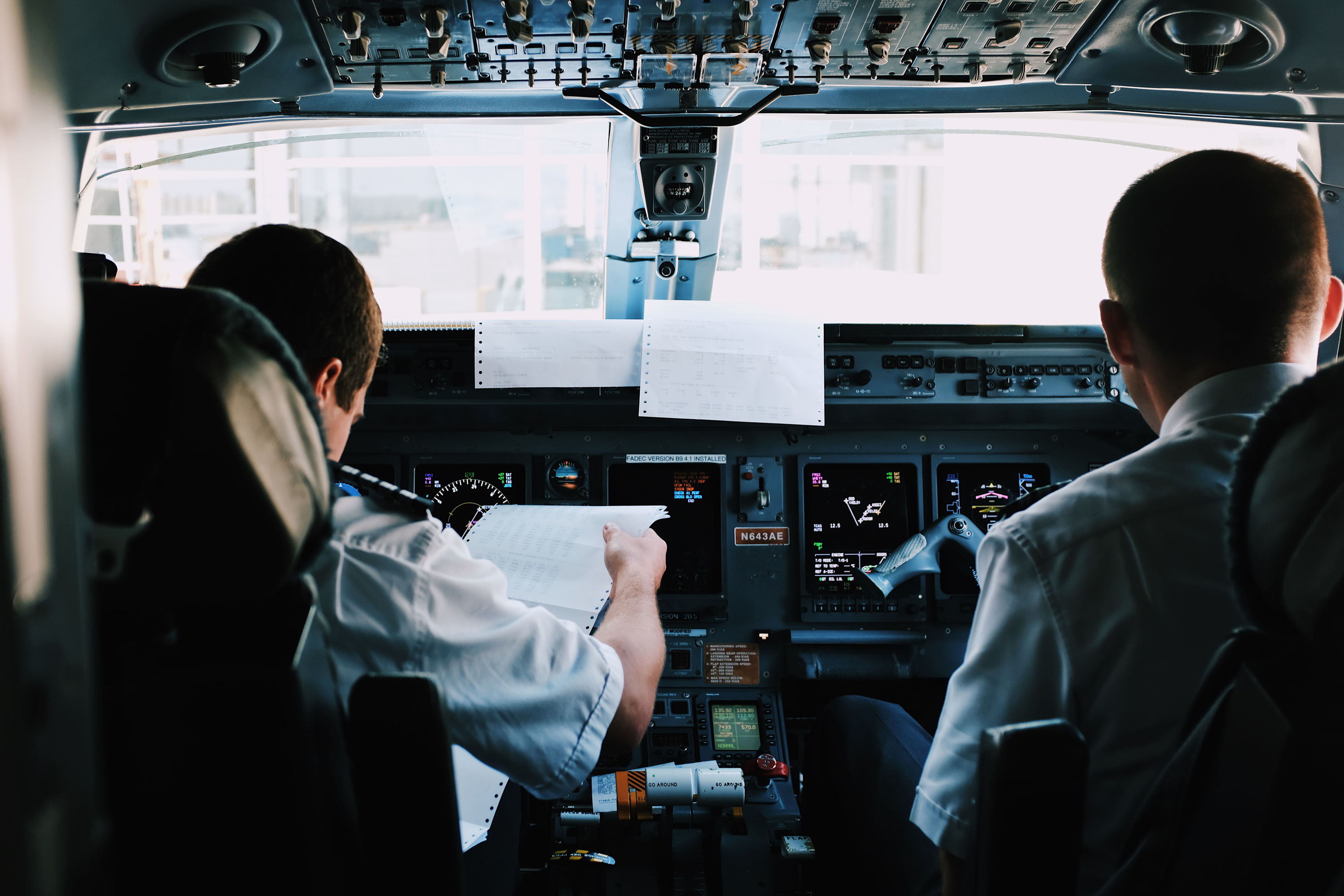 Two pilots in the cockpit of a plane