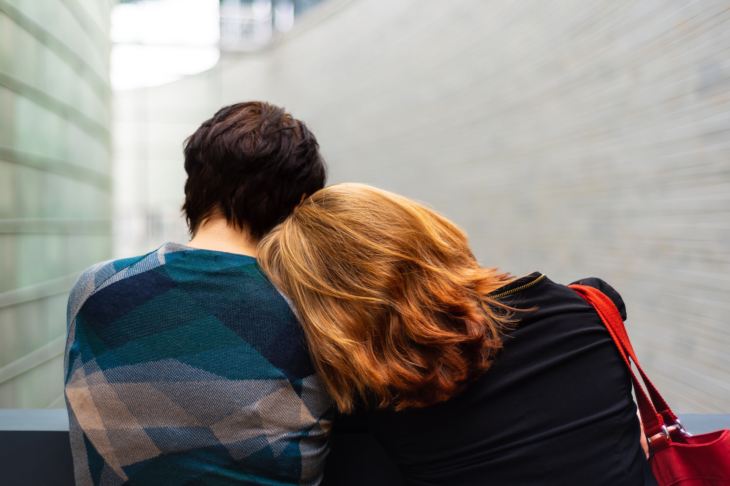 Woman leaning her head on a man's shoulder