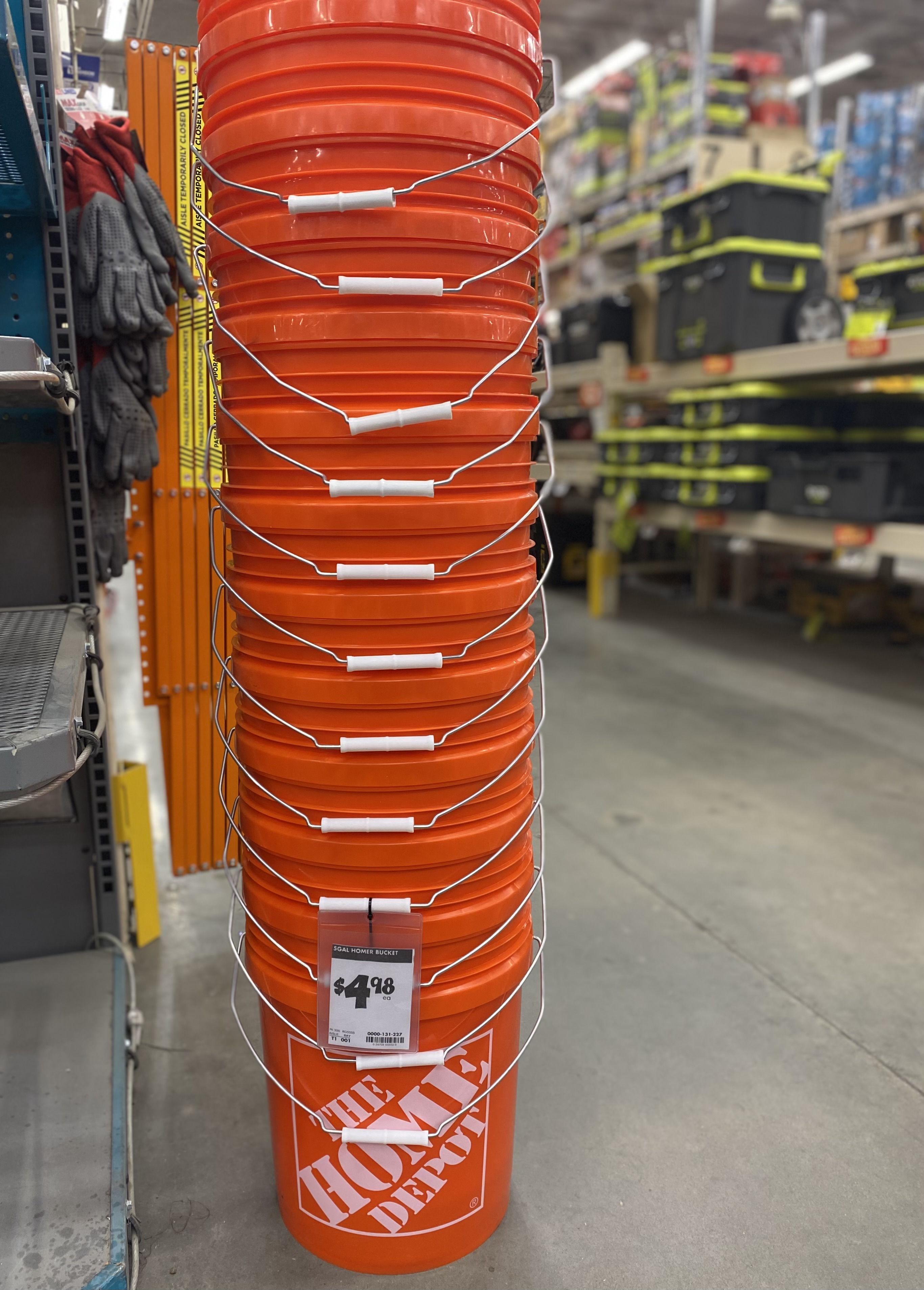 Stack of orange 5-gallon buckets