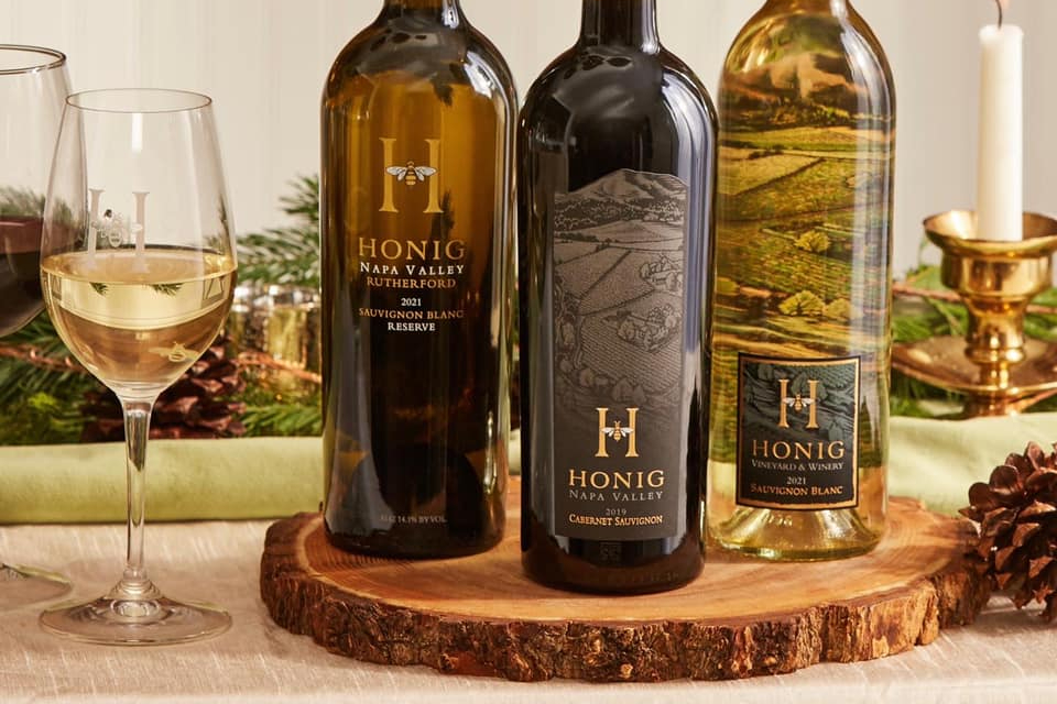 A set of three Honig wine bottles.