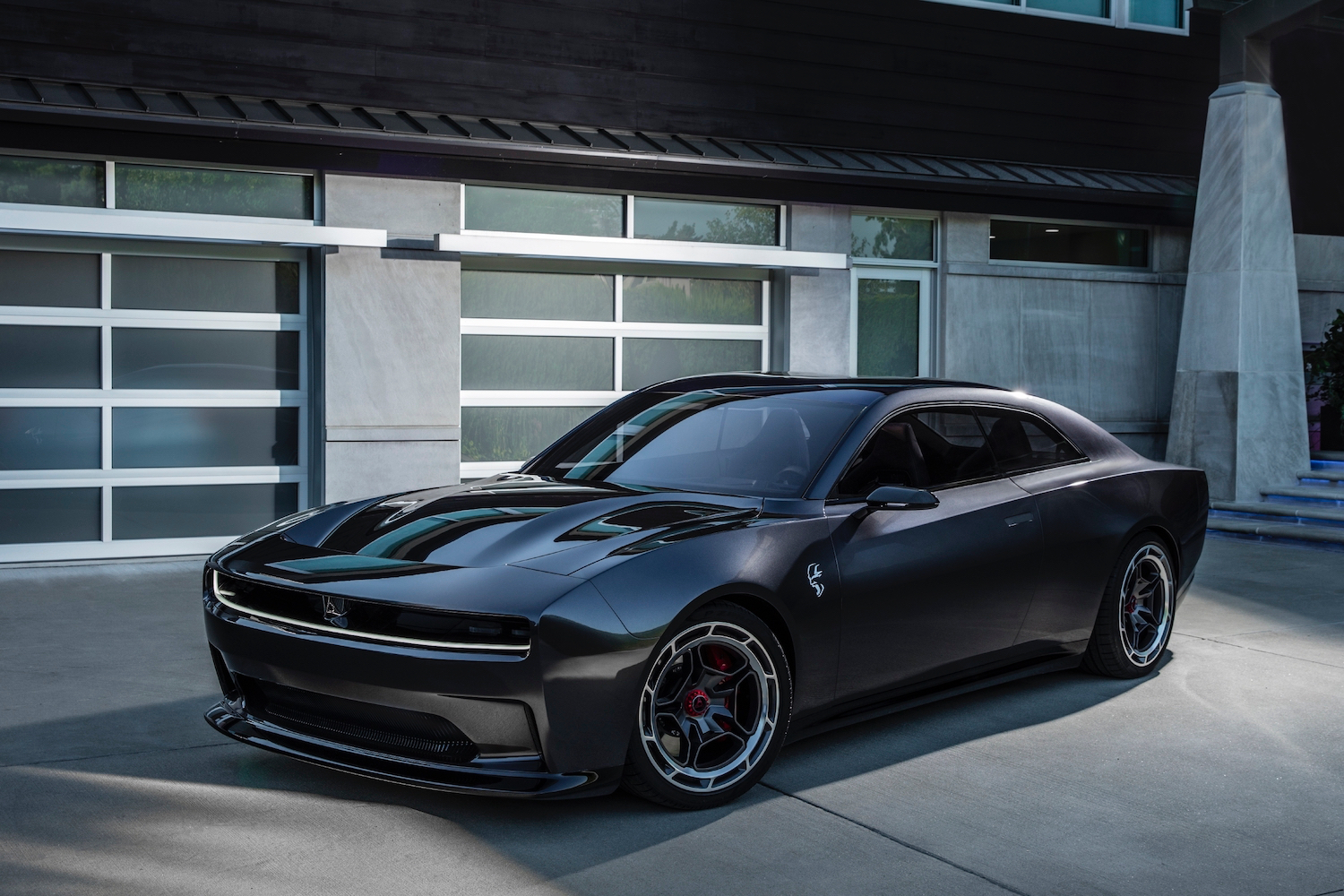 Dodge Charger Daytona SRT Concept front end angle from driver's side parked in front of a garage.