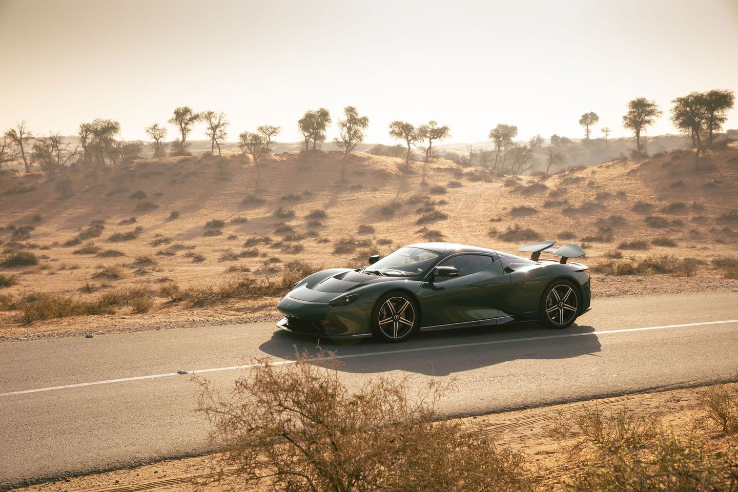 Automobili Pininfarina Battista electric hypercar against a desert backdrop.