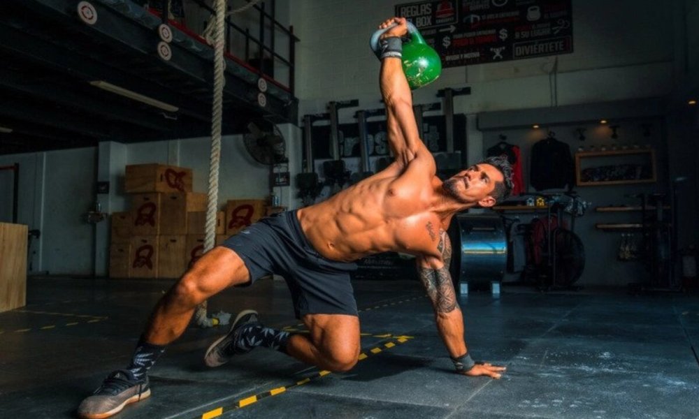 Man doing ab exercise with kettlebell