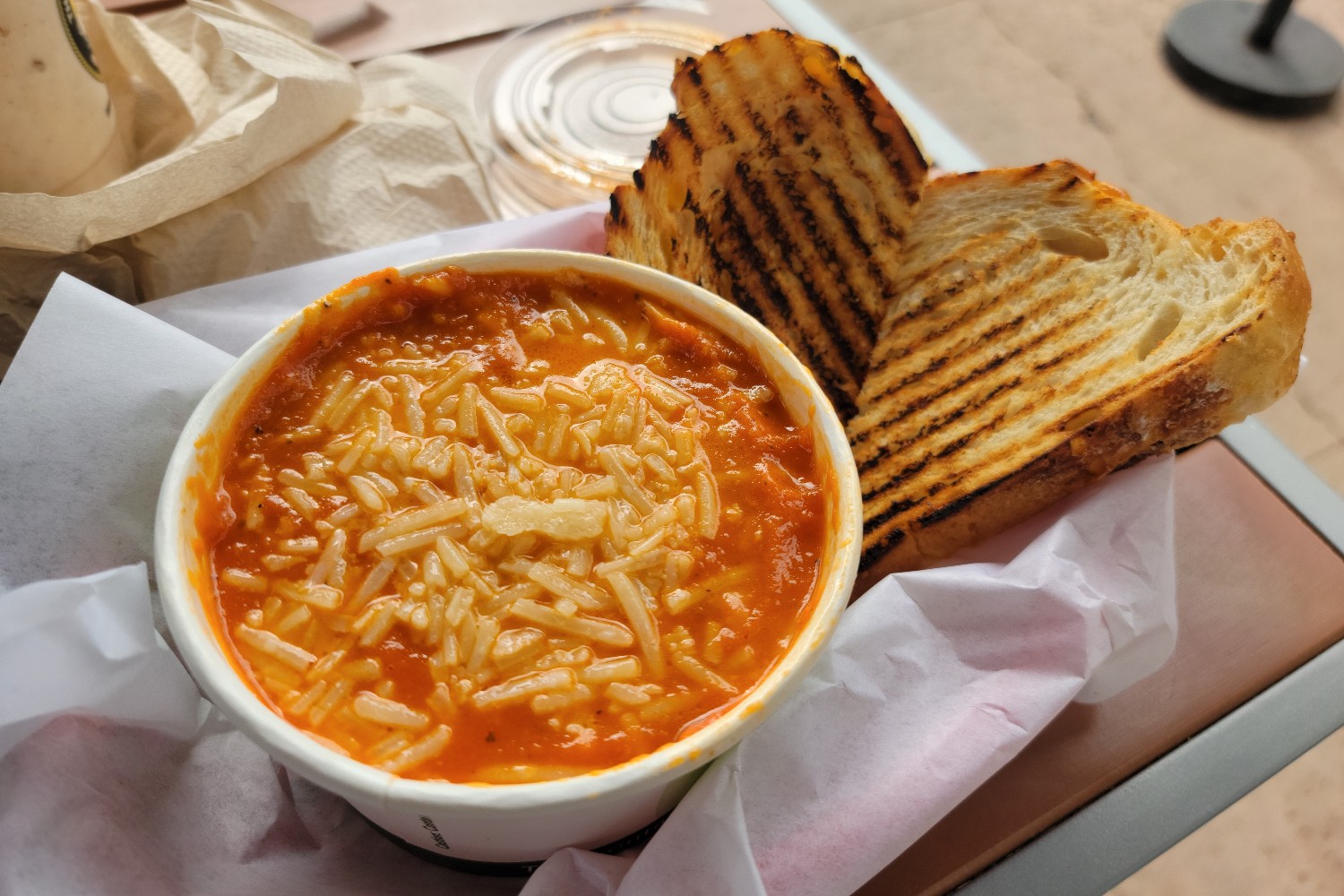 A cup of tomato bisque and a grilled cheese sandwich at Coffee Importers in Dana Point, California.