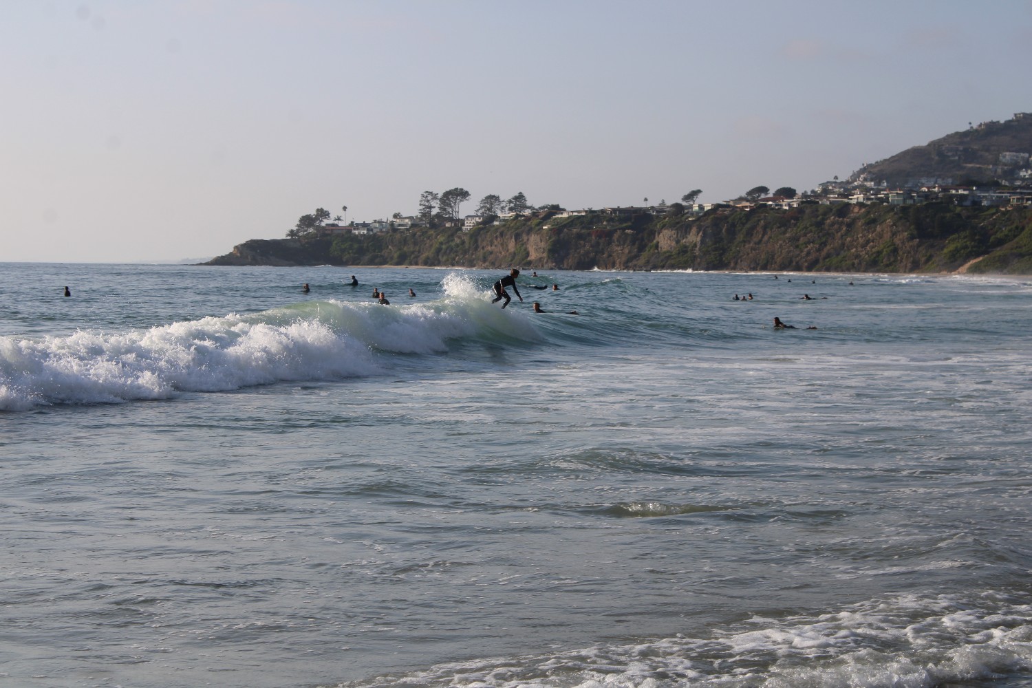 A surfer rides a wave at Salt Creek Beach in Dana Point, California.