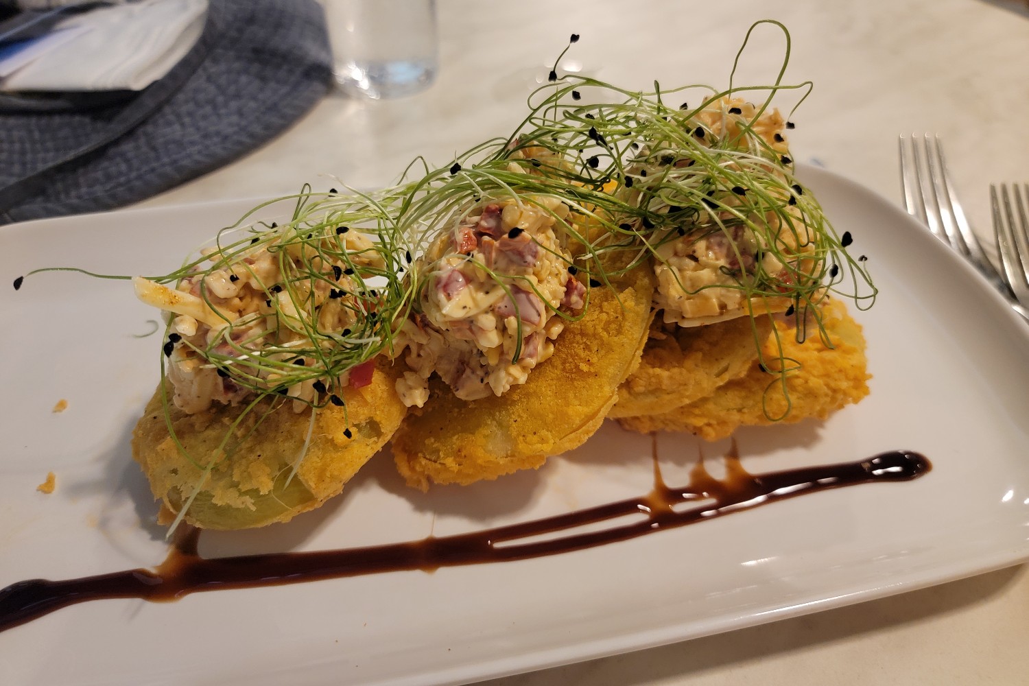 The fried green tomatoes with pimiento cheese at 8595 Restaurant & Bar at The Partridge Inn in Augusta, Georgia.