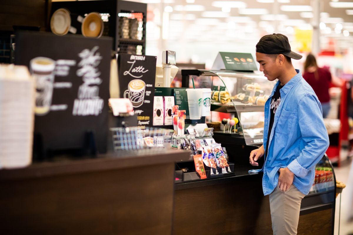 A man in line to order at Starbucks.