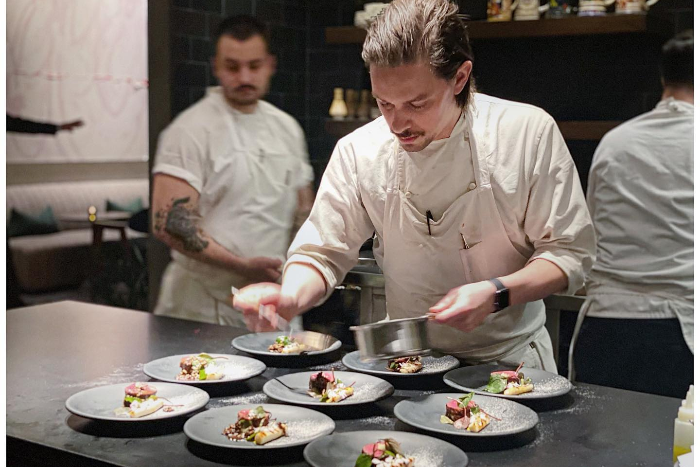 Preparing plates at Oriole in Chicago