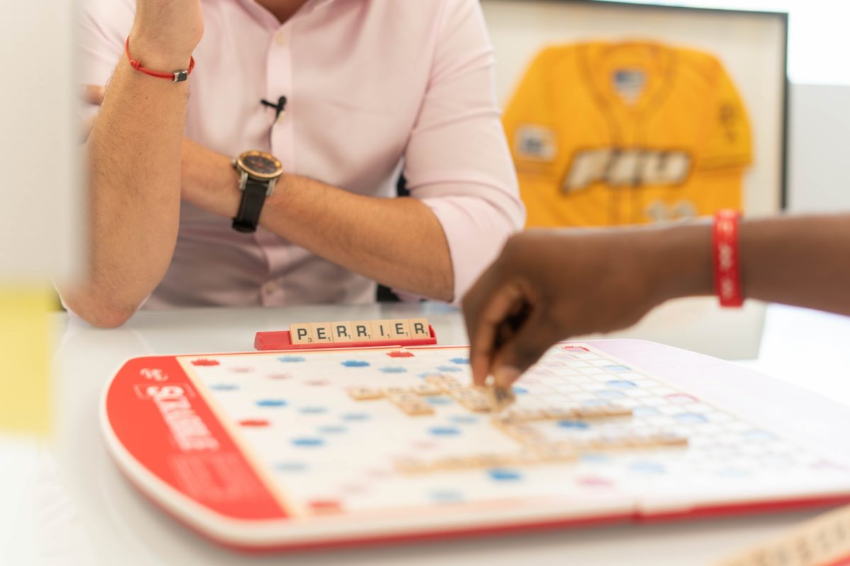 Two people playing Scrabble together.