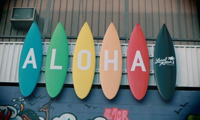 Surfboards that have aloha spelled out on them.