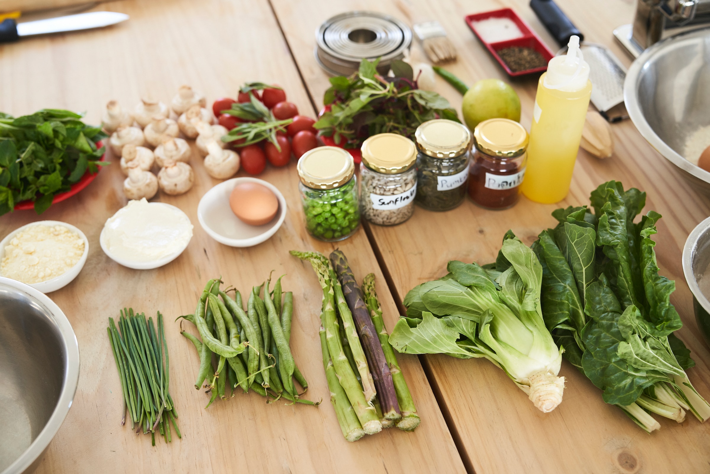 Vegetables on a table with other ingredients