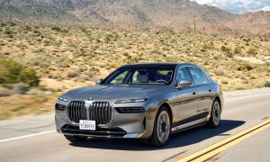 2023 BMW i7 driving on the road.