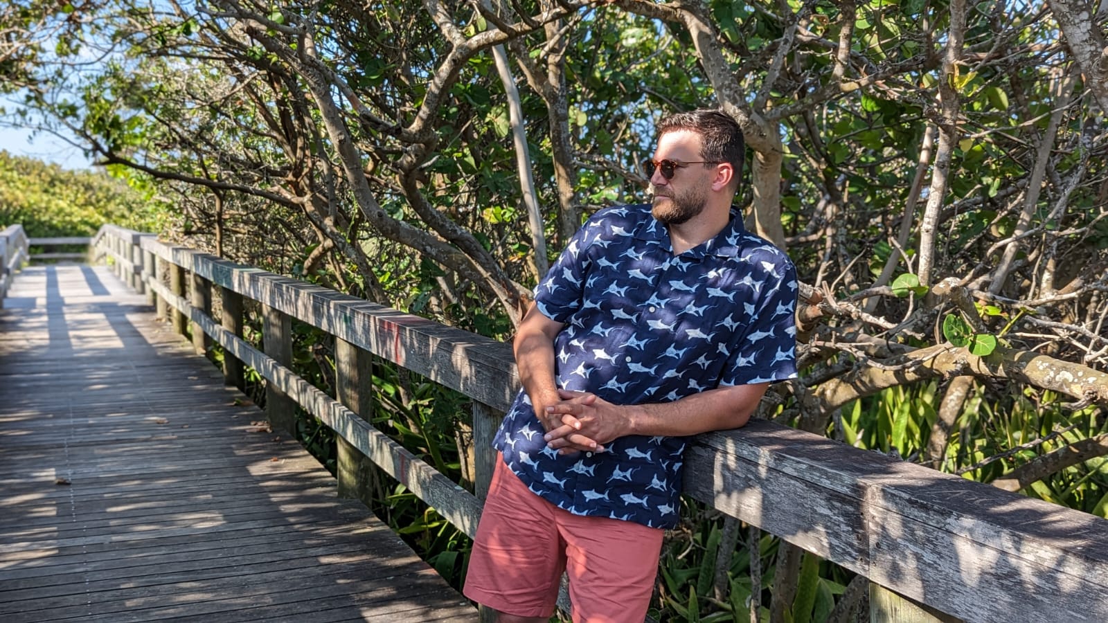 Man in UNTUCKit x David Hart summer collection in the woods