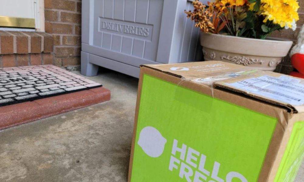 A HelloFresh delivery box sitting on a front porch