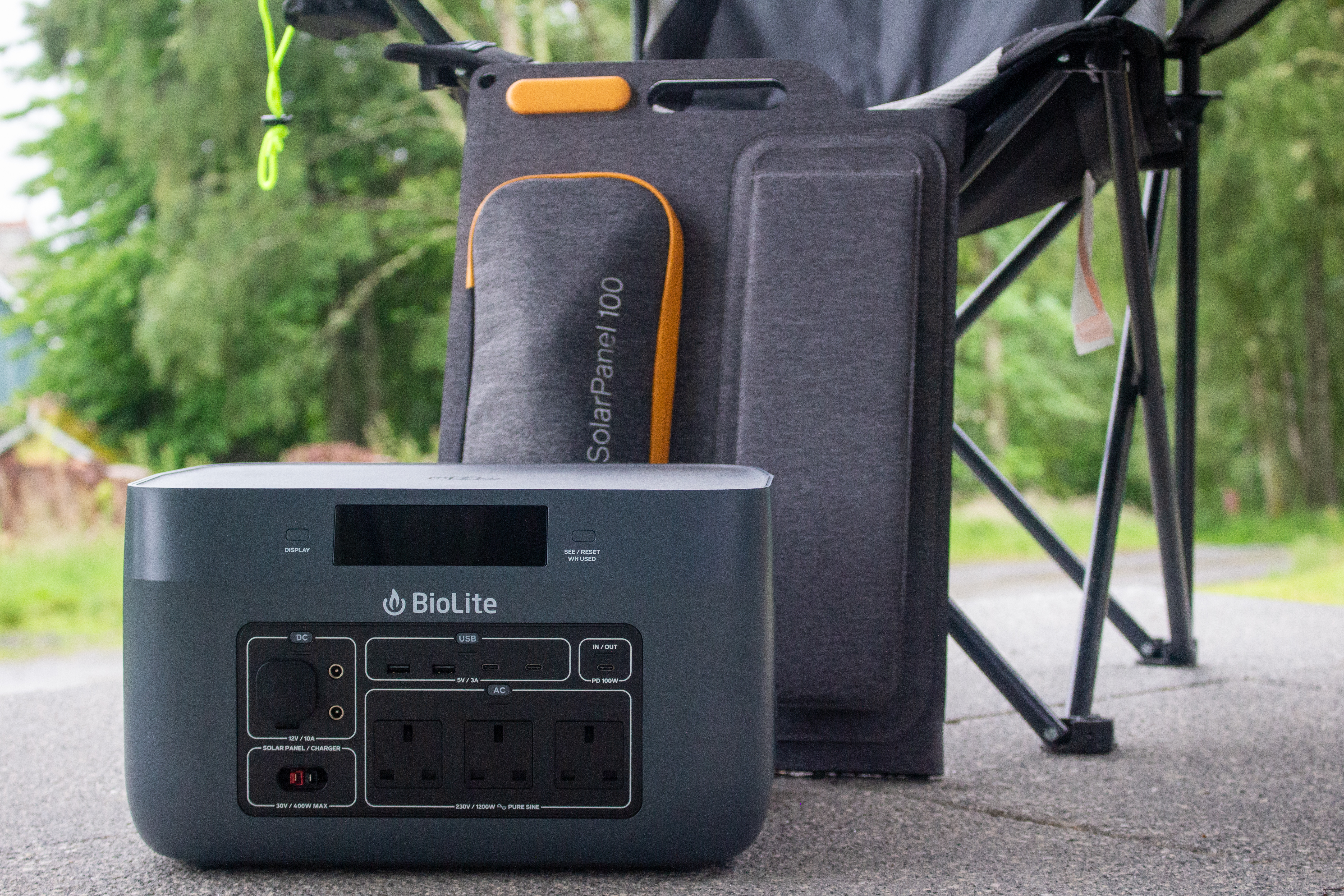 A BioLite BaseCharge unit and SolarPanel 100 by a camping chair