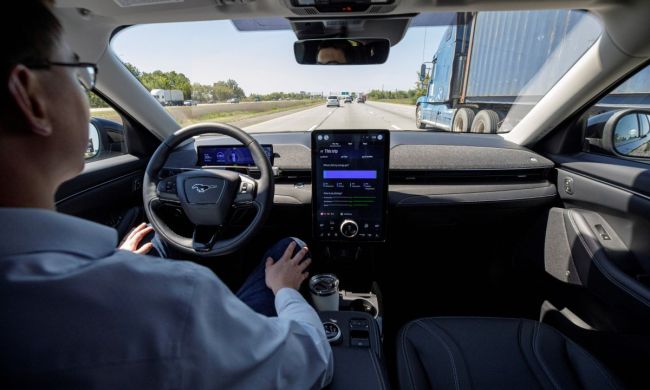 A driver using BlueCruise hands-free driving technology