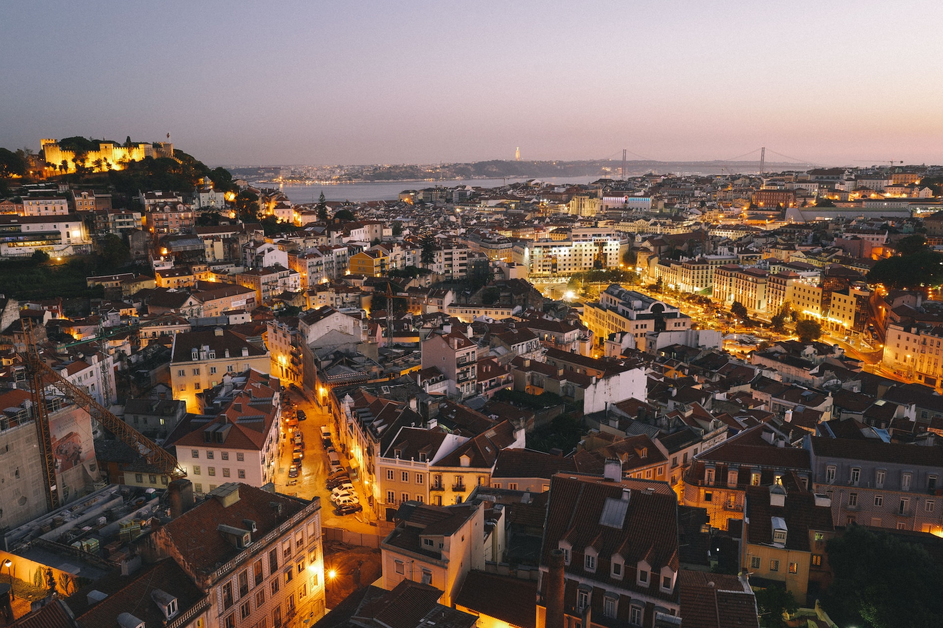 Aerial view of downtown Lisbon, Portugal at dusk.