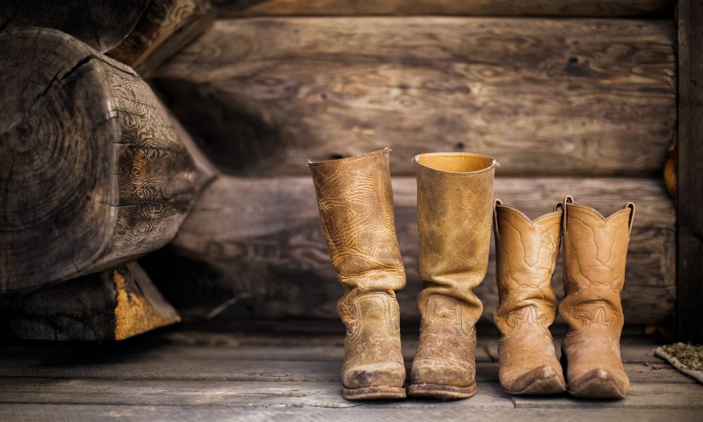 Cowboy boots on a wooden porch