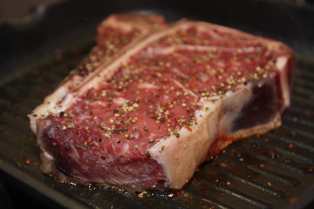 Cut of steak on a grill.