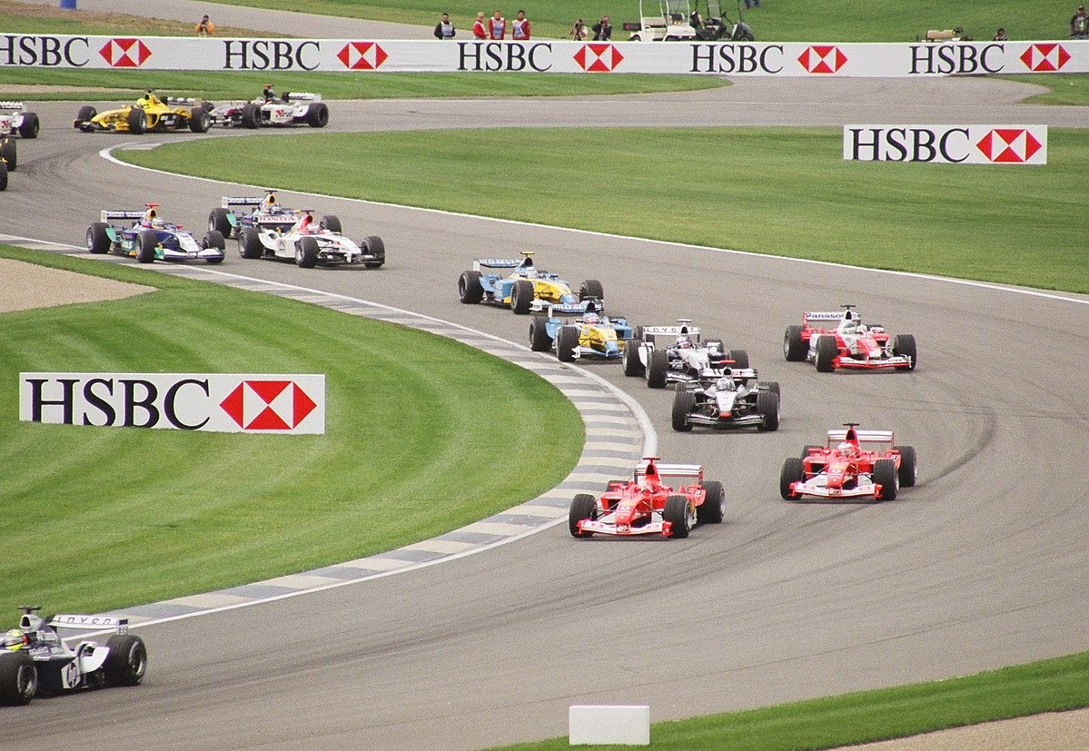 Formula 1 cars winding their way down a track.