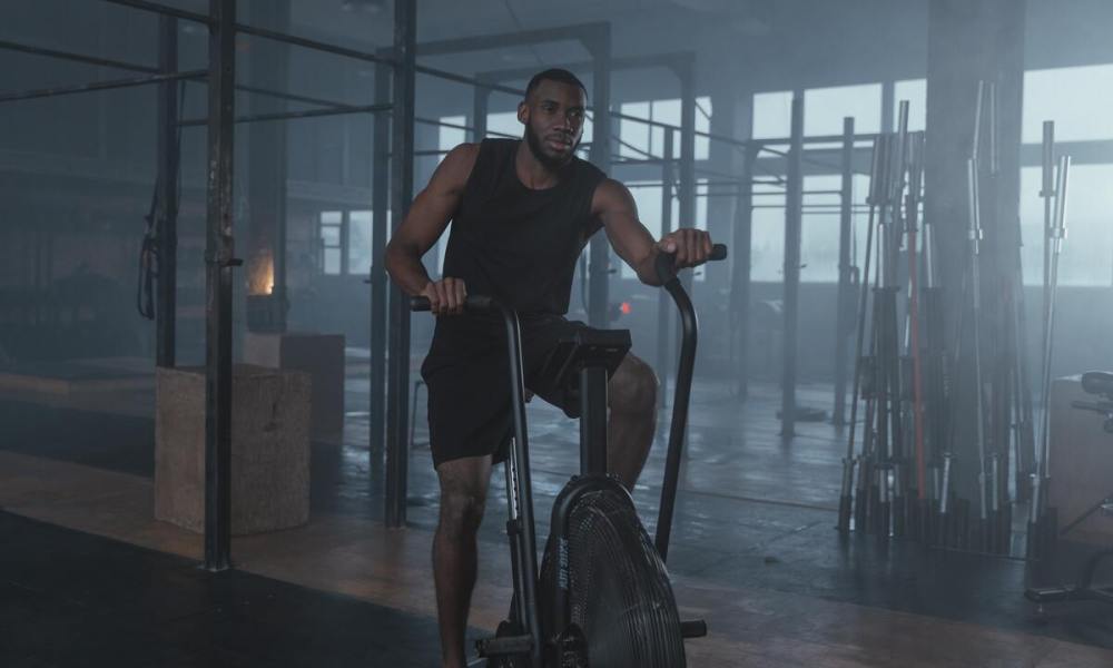 Man on stationary bike in the gym