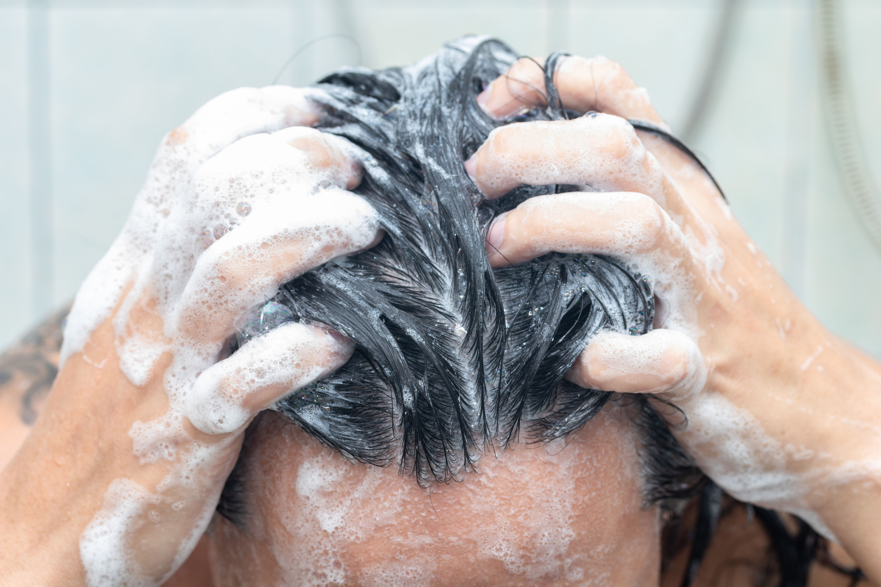 Man washing his hair