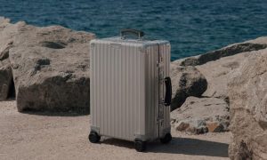 Rimowa suitcase by the beach