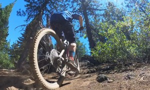 Pedaling a mountain bike up a hill is harder than going down. Riders coming down should stop.