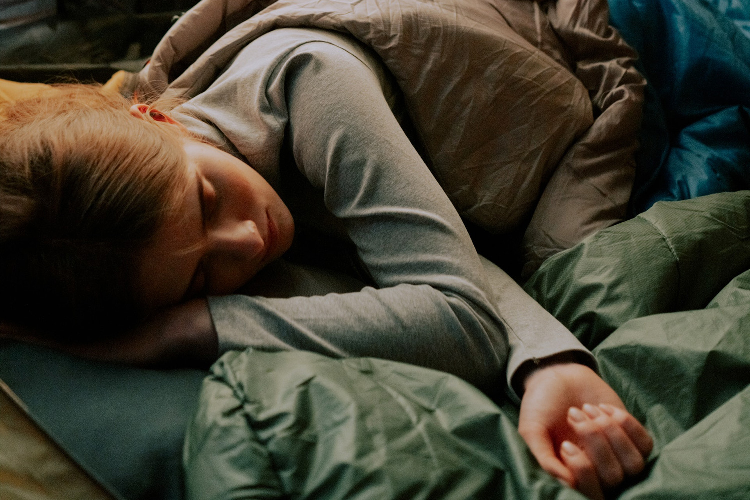 Woman sleeping soundly in a tent.