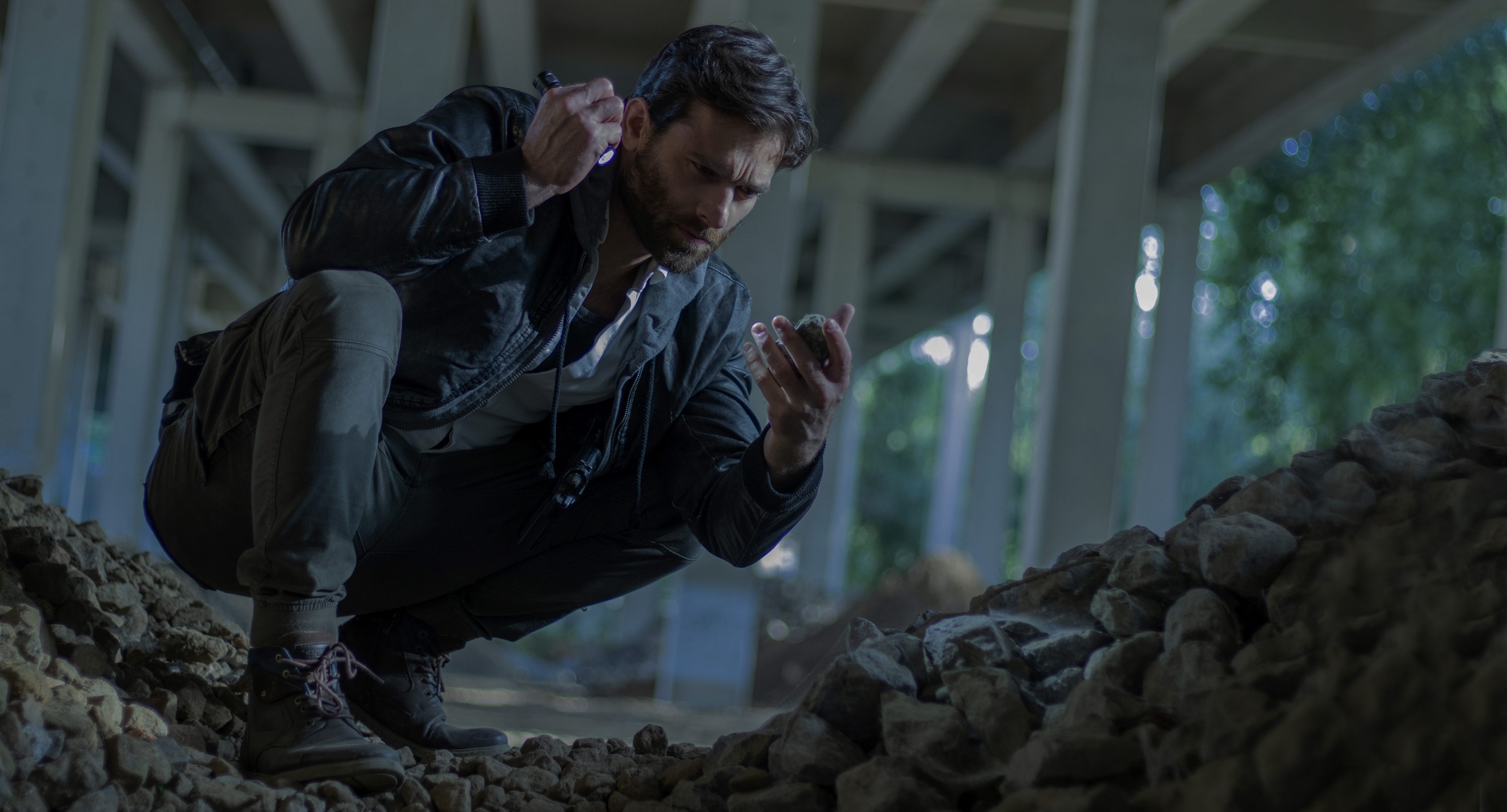 Man kneeling in rubble