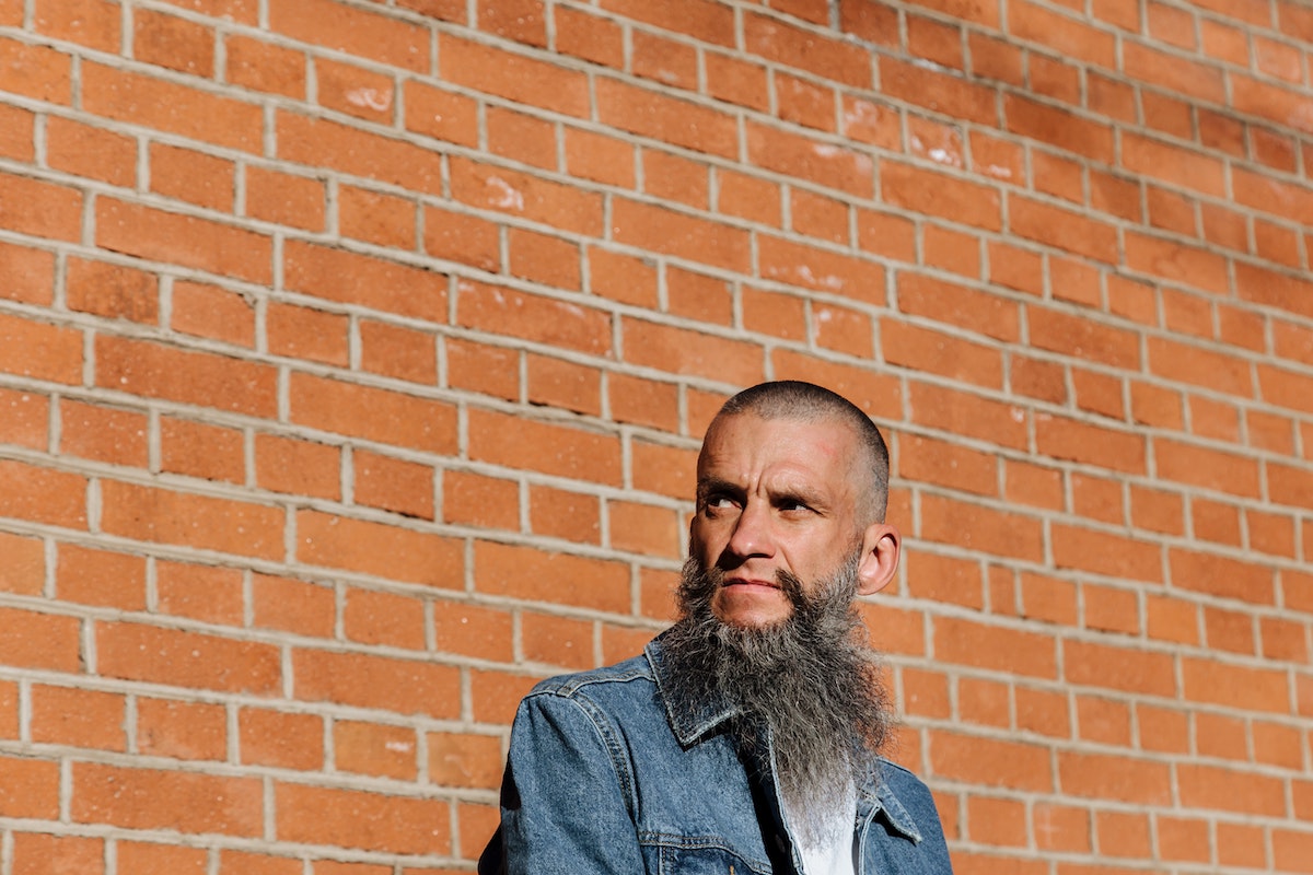 An adult man with a long gray beard