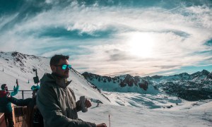 Man drinking at ski lodge