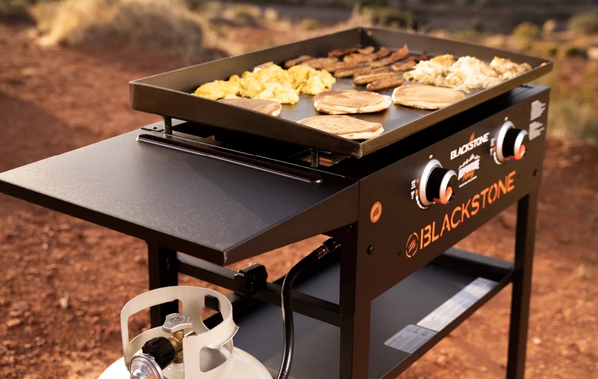 https://www.themanual.com/wp-content/uploads/sites/9/2023/10/Blackstone-Griddle-two-burner-with-breakfast-cooking-e1697655186282.jpg?fit=800%2C506&p=1