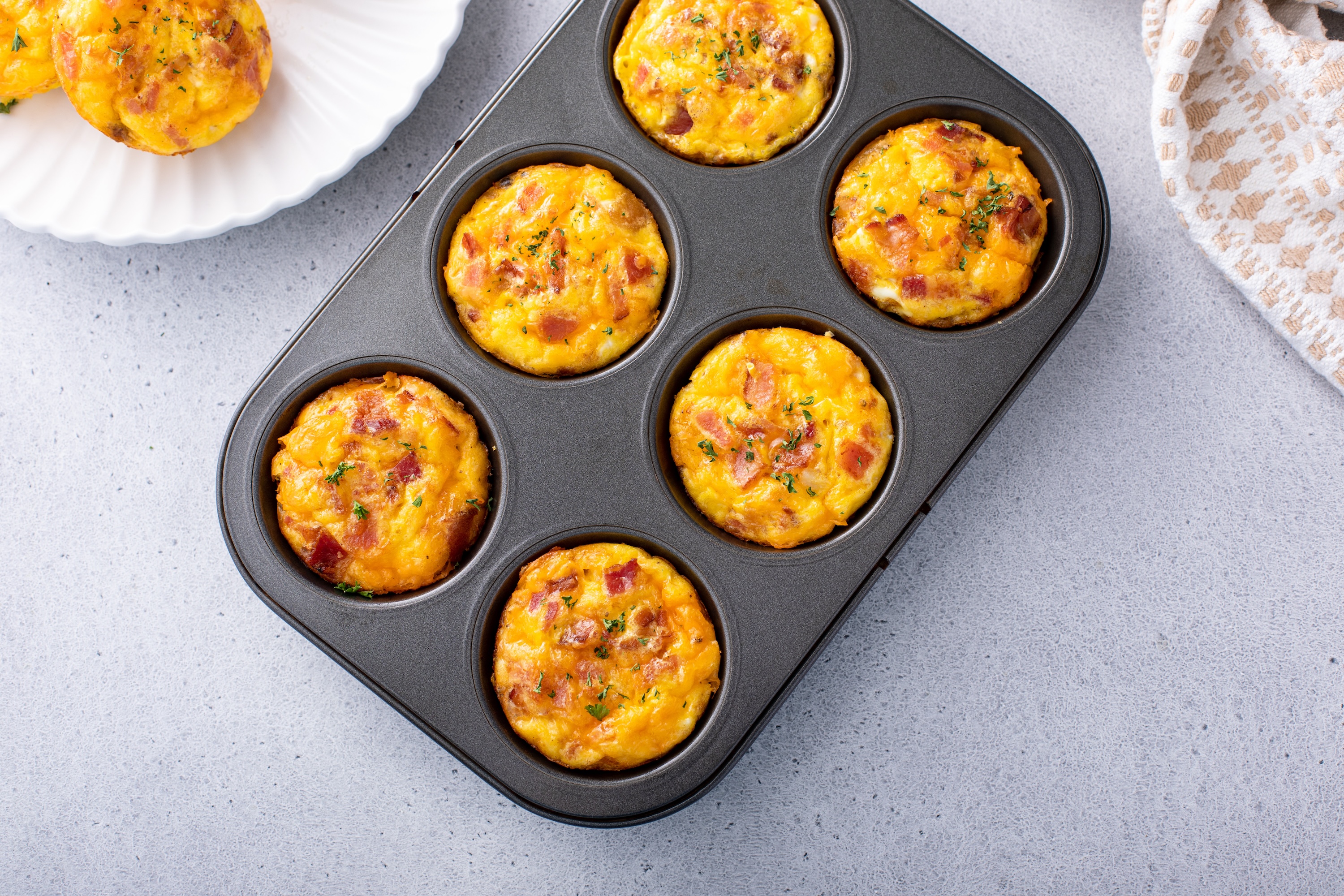 https://www.themanual.com/wp-content/uploads/sites/9/2023/10/egg-bites-in-muffin-tins.jpeg?fit=800%2C533&p=1