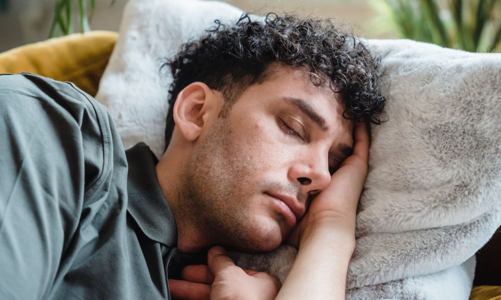 Man sleeping on soft white pillow