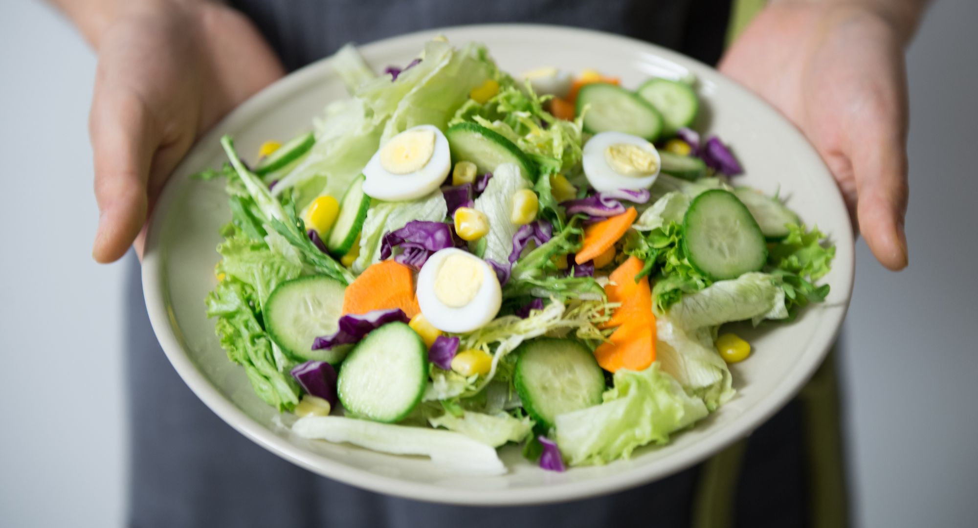 Person holding salad