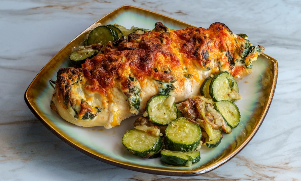 Baked roasted hasselback chicken stuffed with ricotta cheese and spinach