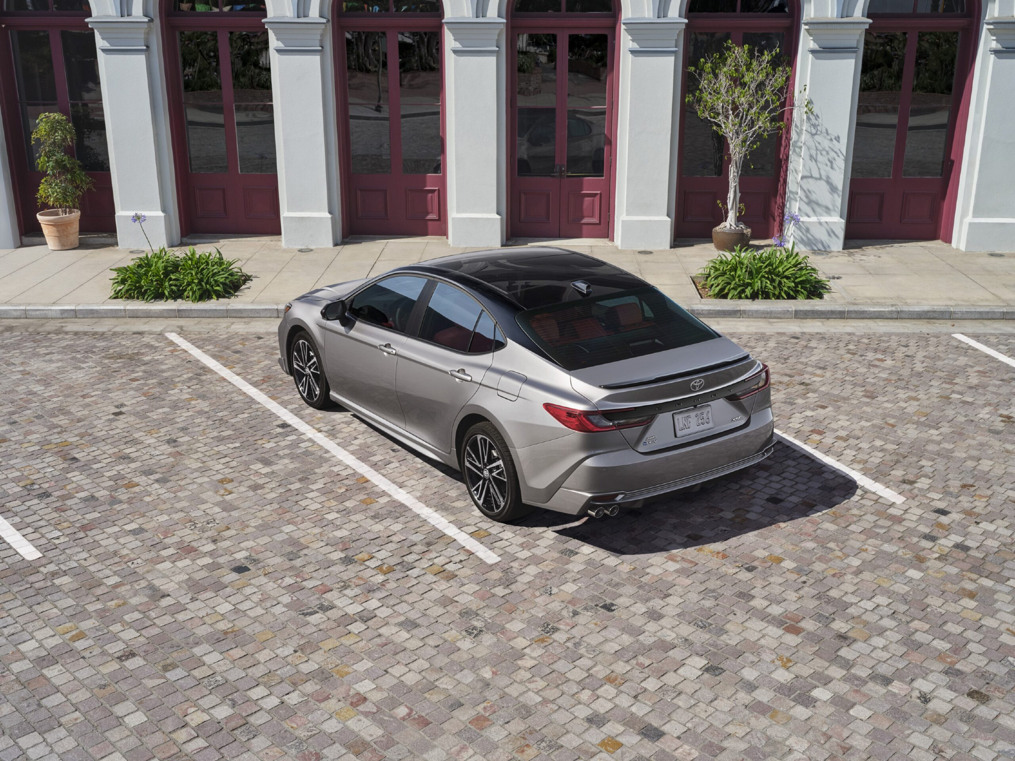 2025 Toyota Camry left rear three-quarter view.